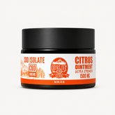 Jar of CBD isolate citrus ointment with black lid on a white background