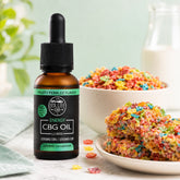 Bottle of CBG oil with colorful cereal on a table