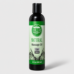 A black plastic bottle of Our Life CBD Natural Massage Oil with a green and white label, set against a light gray background.