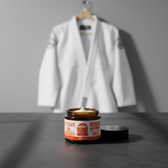 Jar of cbd  balm with a gi  in the background