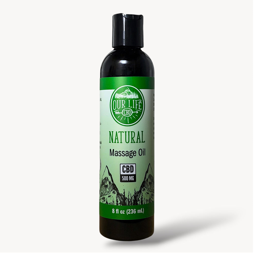 Bottle of natural massage oil with CBD label on a white background