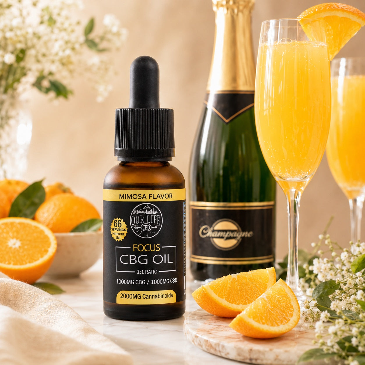 Bottle of CBG oil with a mimosa flavor, champagne bottle, and glasses with orange juice on a table.