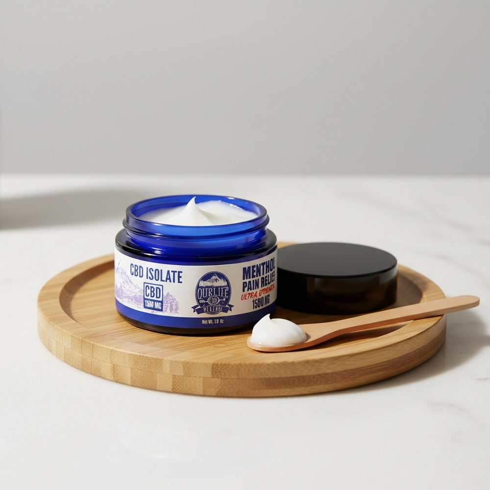 Jar of CBD isolate cream on a wooden tray with a white background