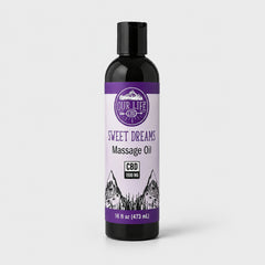 A 16 fl oz black bottle of Our Life CBD Sweet Dreams Massage Oil with a purple and white label, set against a light gray background.